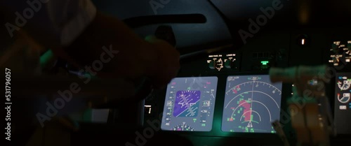 CU on airplane weather radar screen inside the cockpit, aircraft going through thunderstorm rain clouds, heavy turbulence photo