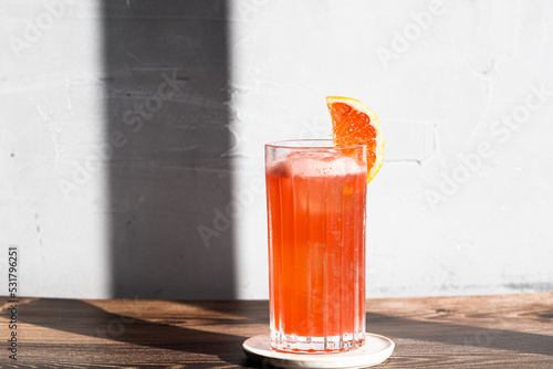 Picture of grapefruit garibaldi cocktail in a highball glass photo