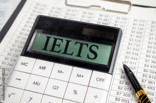 IELTS word on display calculator and pen with charts