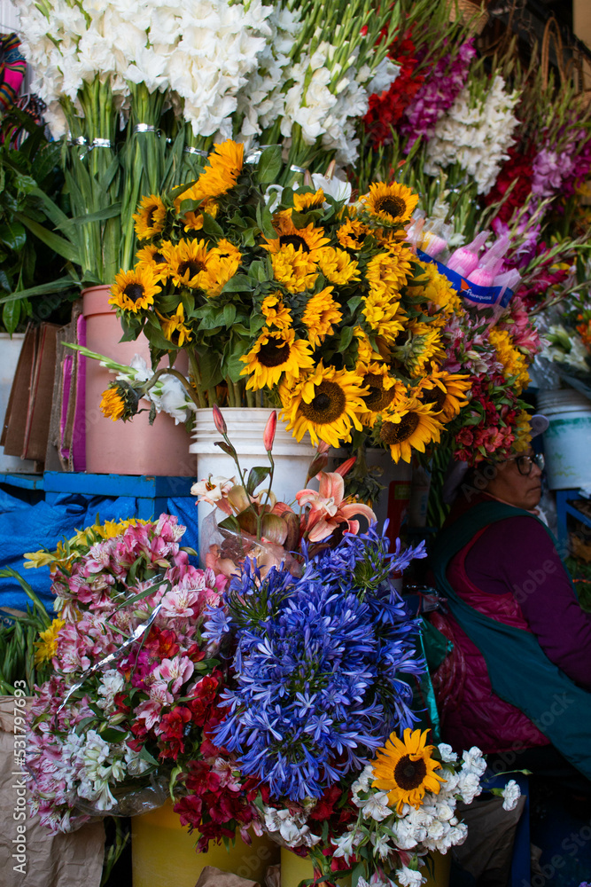 Sale of various colourful flowers in the market of San Pedro, Cusco, Peru. 