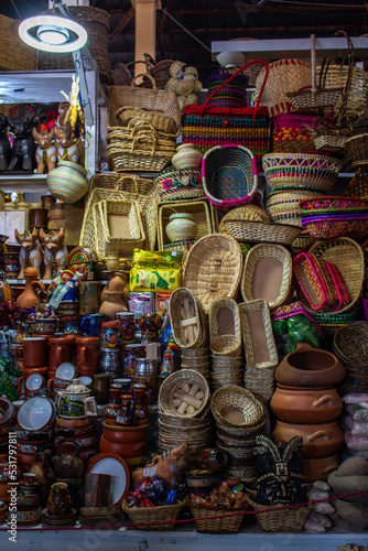 Sale of wicker baskets and various decorative items in the market of San Pedro, Cusco, Peru. 