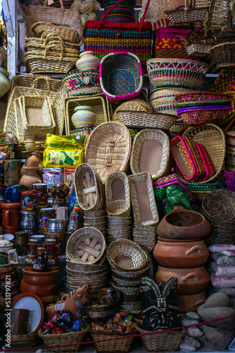 Sale of wicker baskets and various decorative items in the market of San Pedro, Cusco, Peru. 