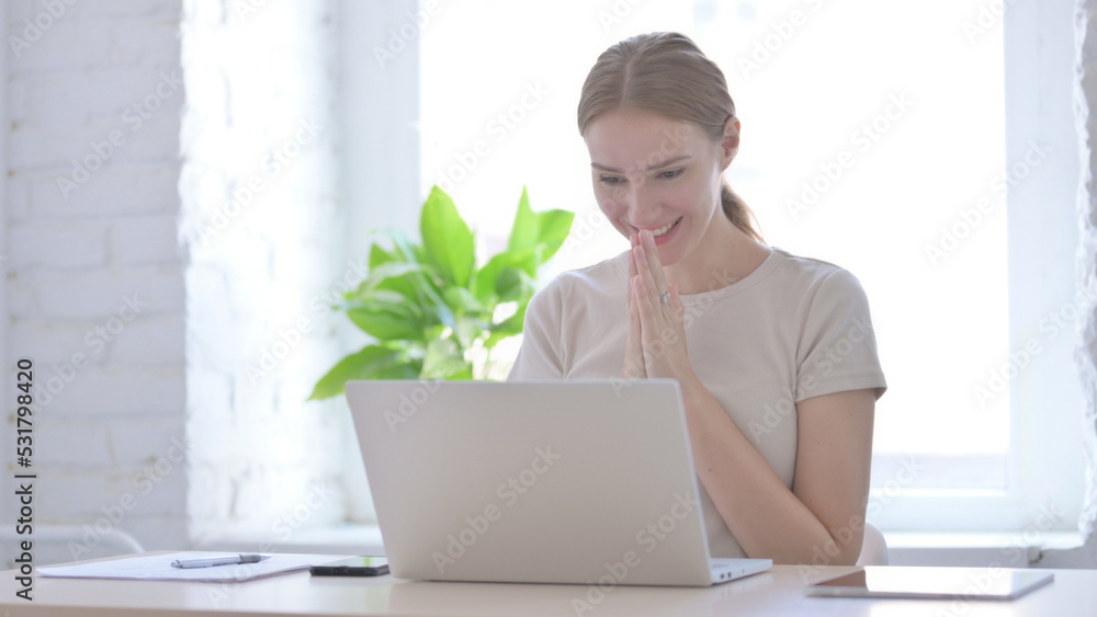 Woman Celebrating Online Success on Laptop in Office Woman Celebrating Online Success on Laptop in Office