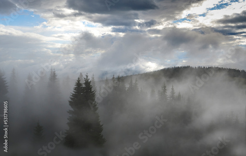 Incredible view of the Carpathian mountains early in the morning. sunrise in the mountains. Cloudy sky after rainy night on the top of the hill. Mountain valley at sunrise. Rain drops on lens