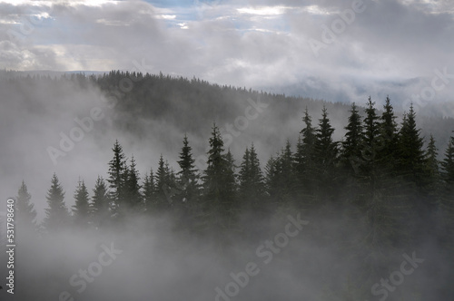 Incredible view of the Carpathian mountains early in the morning. sunrise in the mountains. Cloudy sky after rainy night on the top of the hill. Mountain valley at sunrise. Rain drops on lens © Василь Івасюк