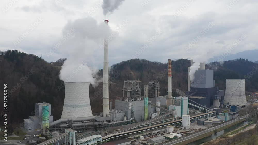 Thermal power station area, coal-fired plant converting heat into electric power, drone view. Energy for household and commercial use concept. Thermal power station area, coal-fired plant converting heat into electric power, drone view. Energy for household and commercial use concept.
