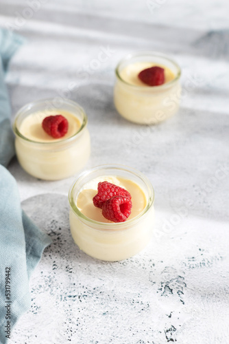 Dessert creme brulee of custard and crispy burnt sugar, on a linen tablecloth. Traditional french cuisine.