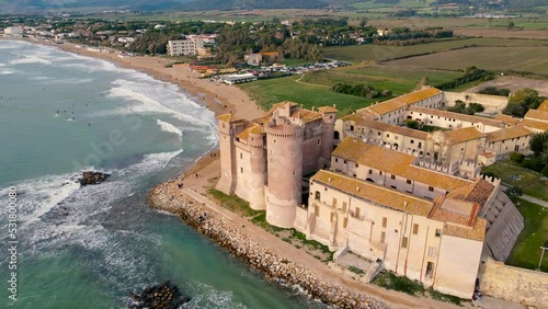 Flying around Santa Severa Castle, with the Beach fading in the distance - slow motion waves 60fps - beautiful fortress by the Tyrrhenian Sea near Rome, Italy - Santa Marinella