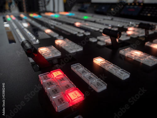 Concept Idea: Professional broadcast video mixer in tv studio as background