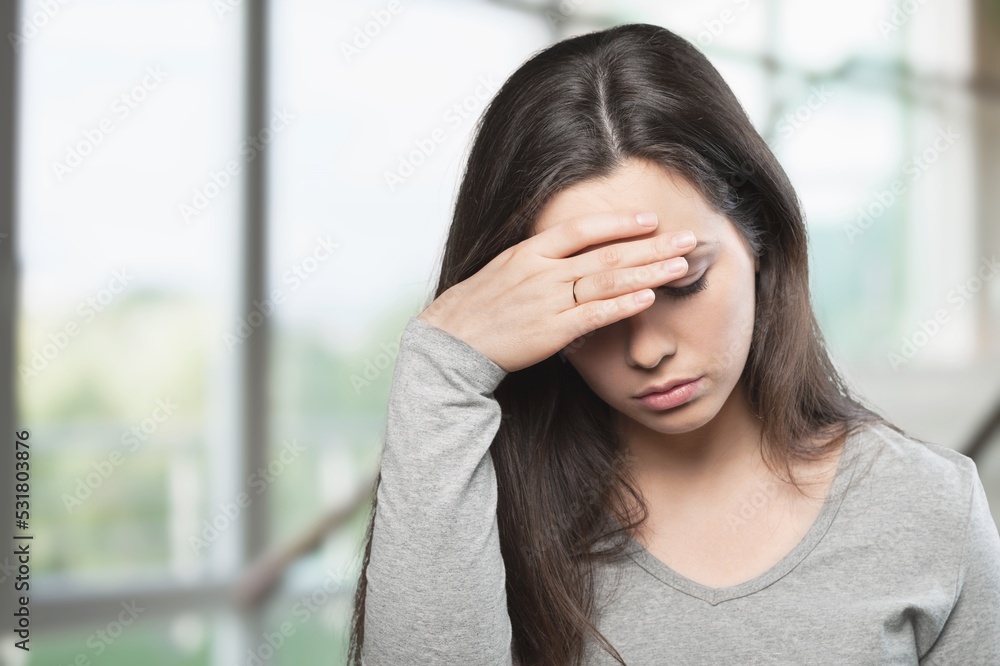 Tired young girl at home, with headache pain concept Tired young girl at home, with headache pain concept