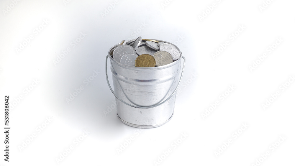 Collection of Indonesian Rupiah Coins in Bucket, Isolated on White Background Collection of Indonesian Rupiah Coins in Bucket, Isolated on White Background