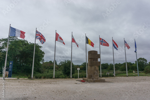 Memorial of battle on D-Day at the Pegasus Bridge between british and german soldiers with flags, Benouville, Normandy, France photo