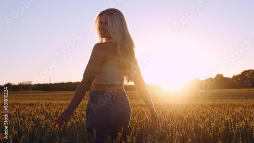 Wallpaper Mural Beautiful Young Woman Walking Through the Wheat Field in Soft Lights of Sunset Torontodigital.ca