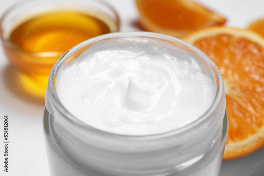 Jar of hand cream on blurred background, closeup Jar of hand cream on blurred background, closeup