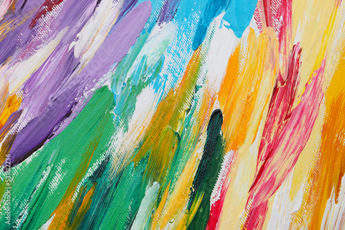 Beautiful strokes of colorful oil paints on white canvas as background, closeup