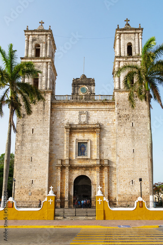 Iglesia de San Servacio in Valladolid, Meixco with palm trees and yellow wall photo