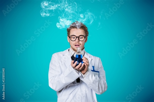 Funny crazy chemist posing on blue background