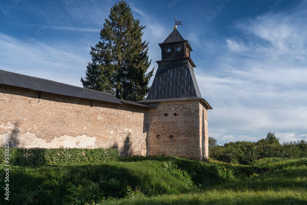View of the Annunciation Tower of the Holy Dormition Pskov-Pechersk Monastery on a sunny summer day, Pechory, Pskov region, Russia