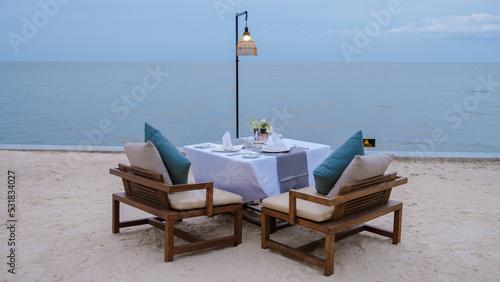 Fototapeta Naklejka Na Ścianę i Meble -  Romantic dinner table by the ocean in Hua Hin Thailand