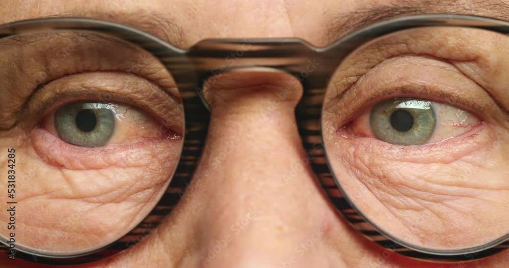 Senior woman face, glasses and eyes for vision, looking around and