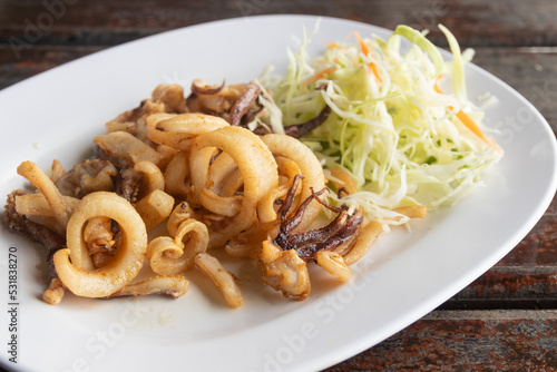 deep fried dried squid on dish. Thai food