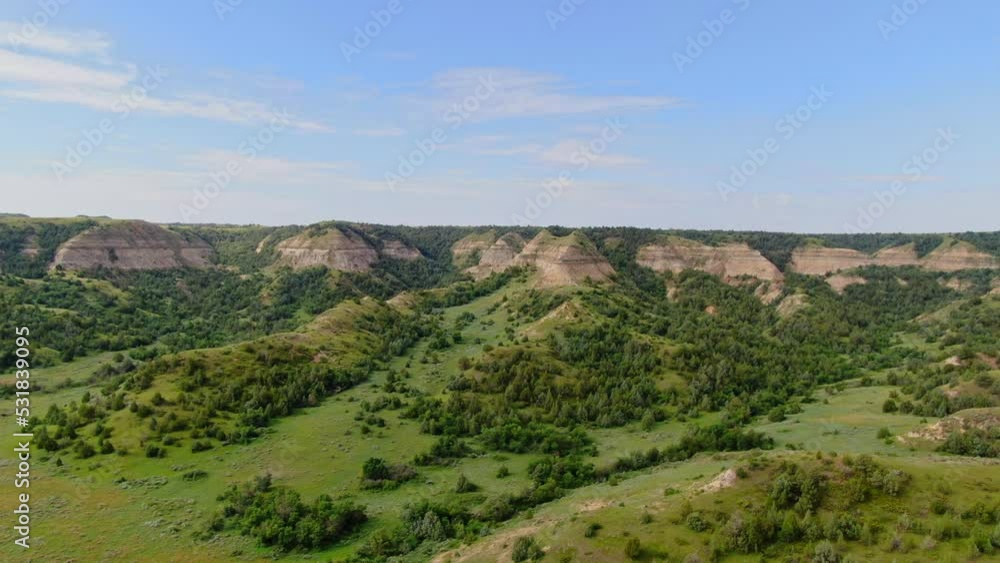 Aerial Rising and Rotating Panoramic View of Vast Wild Grassland in Grassy Butte Region North Dakota, Plain Prairie Rural Area with Vegetation Trees and Mountains in Horizon, Summer Landscape Aerial Rising and Rotating Panoramic View of Vast Wild Grassland in Grassy Butte Region North Dakota, Plain Prairie Rural Area with Vegetation Trees and Mountains in Horizon, Summer Landscape
