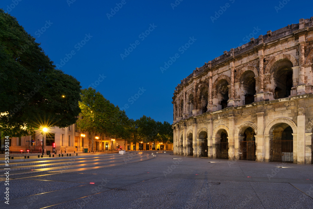 View of famous amphitheater by night, Nimes,