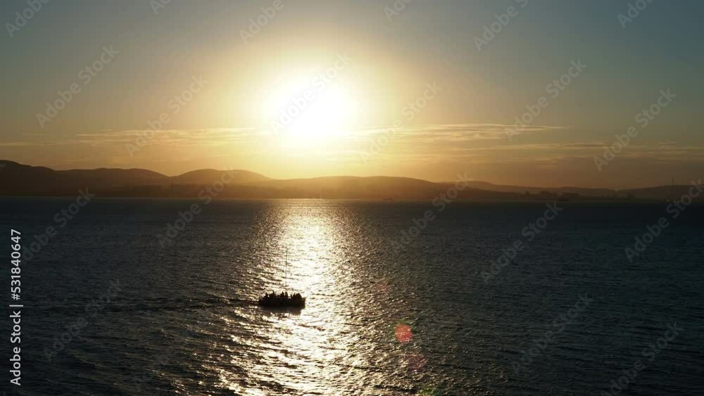 yacht at sunset in a sunny path