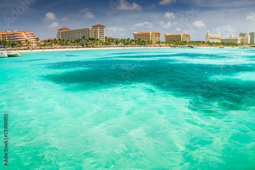 Aruba idyllic caribbean palm beach at sunny day, Dutch Antilles, Caribbean Sea