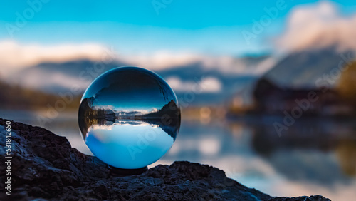Bild auf Leinwand Crystal ball alpine landscape shot with reflections at the famous Pillersee lake