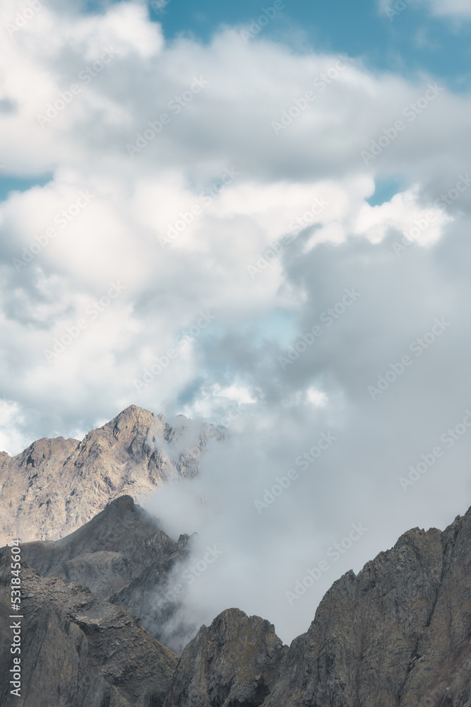 Vertical cloud landscape in the mountains