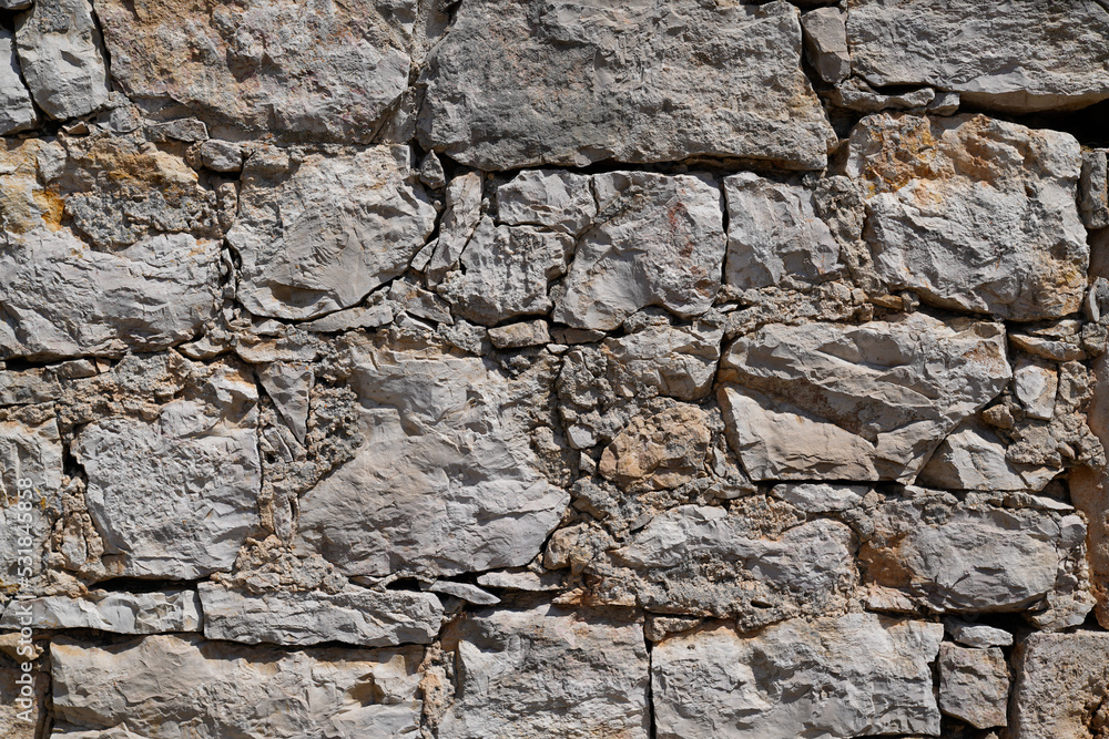 Stone old wall vintage texture grey background siding different sized gray stones