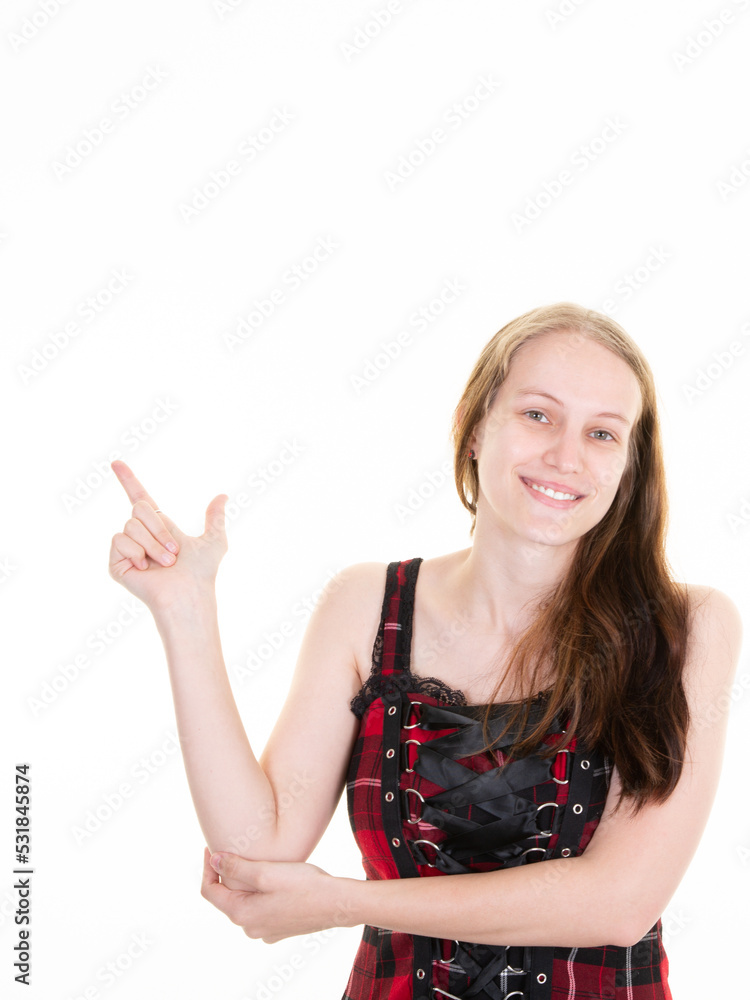woman advertises something at mock-up blank white copy space on side up background pointing indicates with index finger woman advertises something at mock-up blank white copy space on side up background pointing indicates with index finger