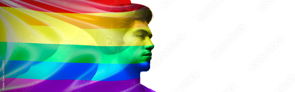 portrait silhouette of man with LGBT pride flag. Rainbow Flag painted on face to show gay pride support on white background. copy space