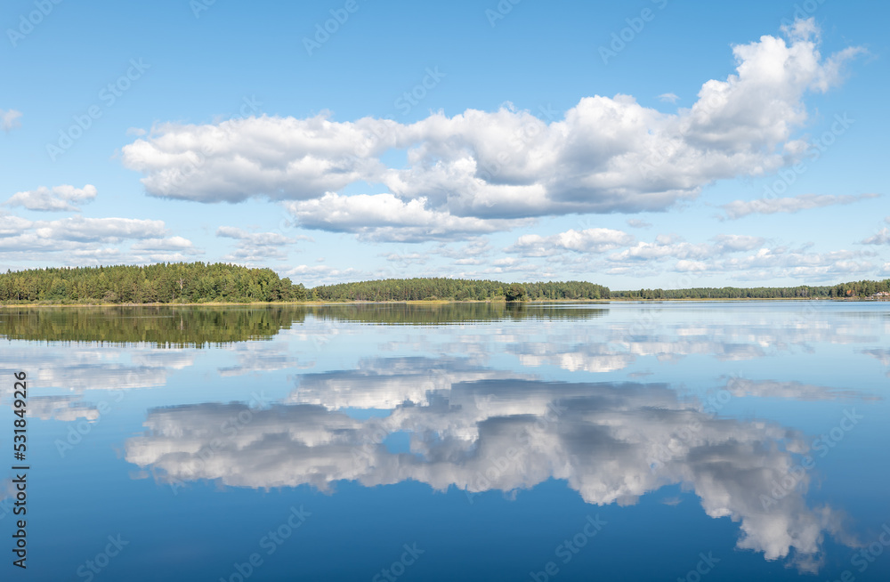 Calm lake reflection in sunset