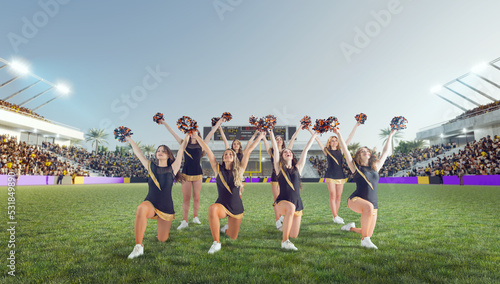 Group of cheerleaders in action on  stadium