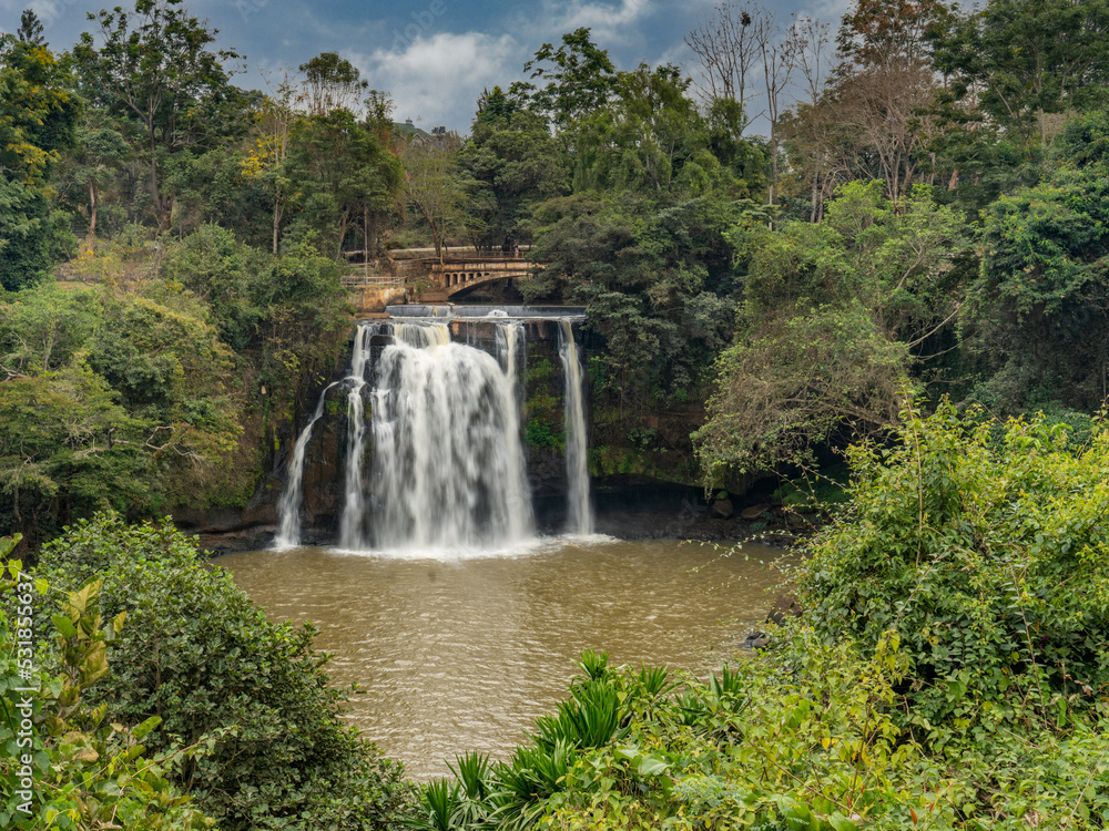 beautiful waterfall with bridge in the background kenya africa