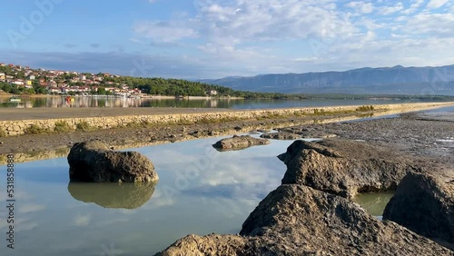 Healthy mud beach in Cizici Soline on Krk island, Kvarner bay of Croatia. Healing mud therapy helps with some skin diseases. photo