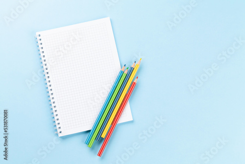 Blank notepad and colorful pencils. Flat lay