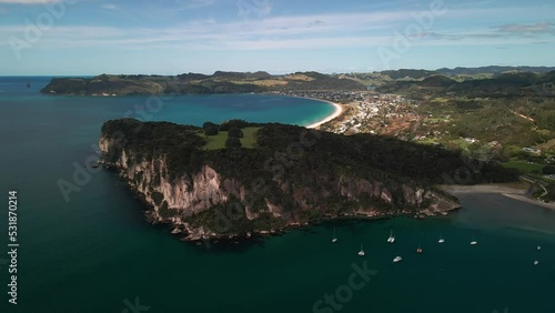 Cinematic drone flight across Mercury Bay photo