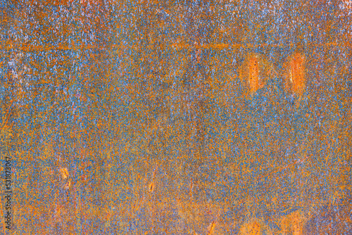 Rust on metal as a background. Corrosion on metal parts. Abstract composition for the design. Bright red rust.