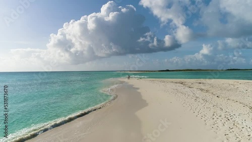 travel in couple just married walking on white sand beach island cayo de agua Los Roques photo