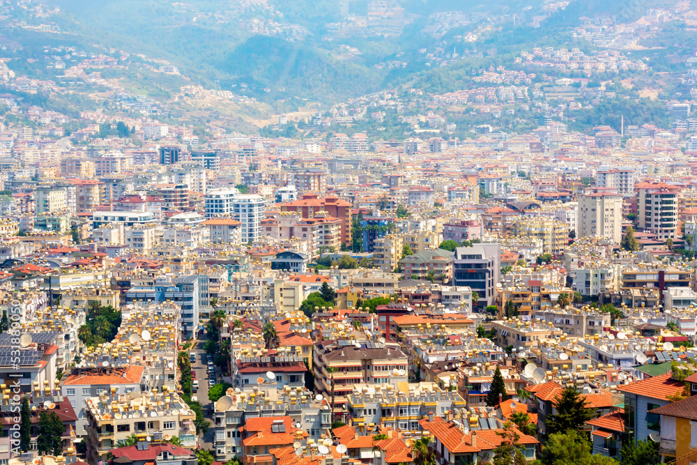 Obraz premium Panorama of Alanya city, Turkey (Turkiye). Modern landscape. A view from above citadel (the Ich Kale fortress). Beautiful cityscape of pupular Turkish resort.