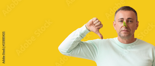 Ill mature man with clothes...