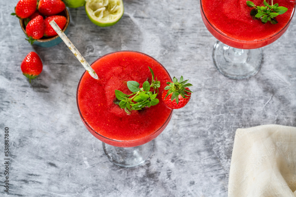 Frozen strawberry daiquiri with white rum garnished with fresh fruit Frozen strawberry daiquiri with white rum garnished with fresh fruit