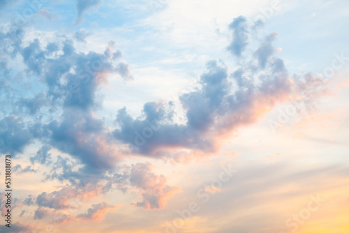 Beautiful pink and yellow clouds in the blue sunset sky