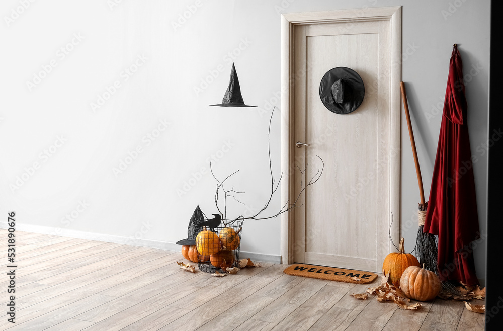 Interior of hall decorated for Halloween with light wooden door - obrazy, fototapety, plakaty 