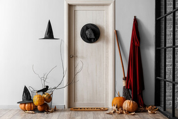 Interior of hall decorated for Halloween with light wooden door