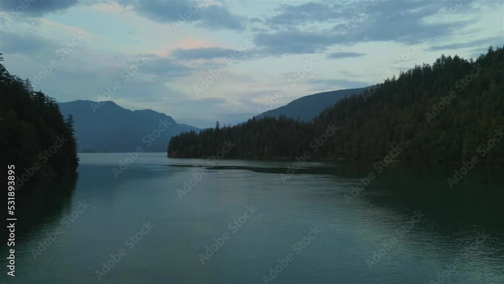 Canadian Nature Mountain Background during colorful Sunset. Harrison River, British Columbia, Canada. Canadian Nature Mountain Background during colorful Sunset. Harrison River, British Columbia, Canada.