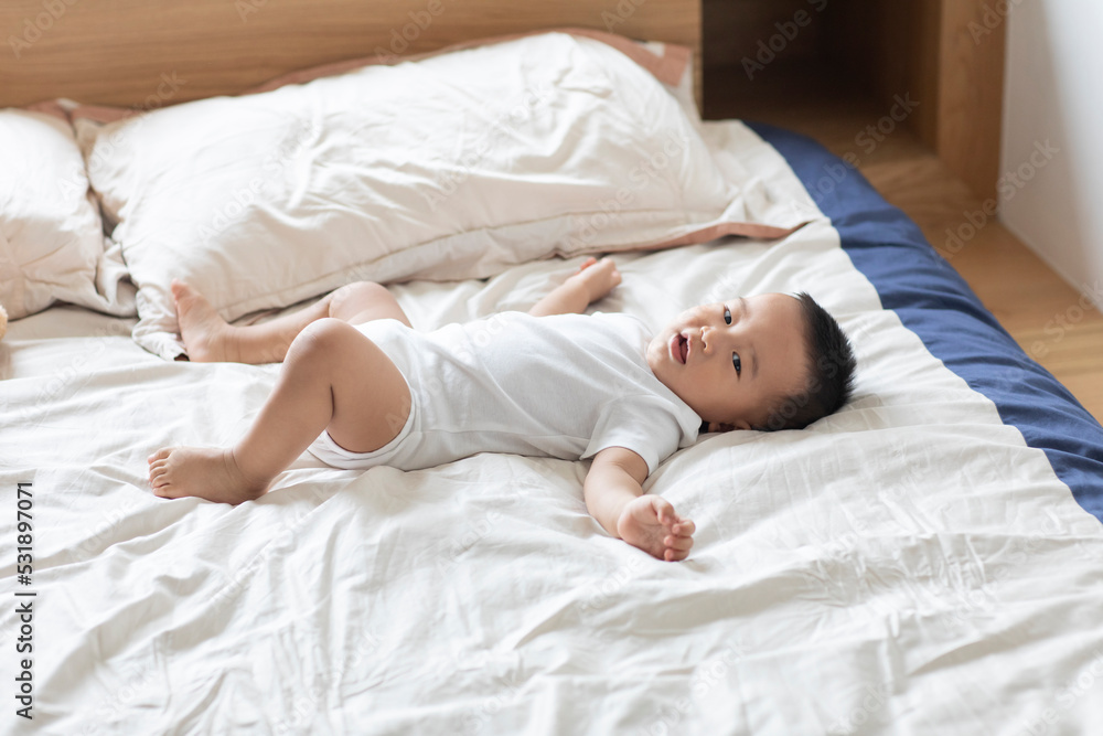 Cute baby lying on bed Cute baby lying on bed